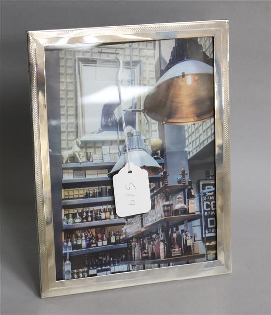 A George V silver mounted rectangular photograph frame, Deykin & Harrison, Birmingham, 1924, 26.8cm.